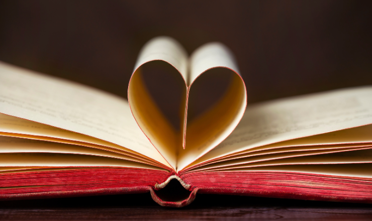 Branch Library Volunteering - Book with pages in the shape of a heart. 