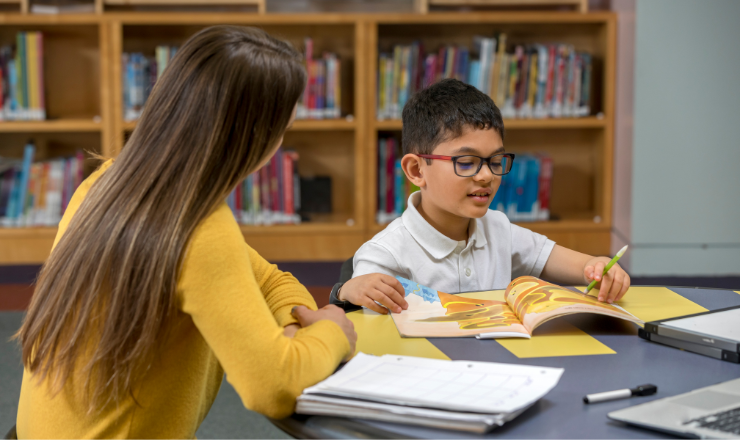 Homework Help Volunteering - woman and child doing homework