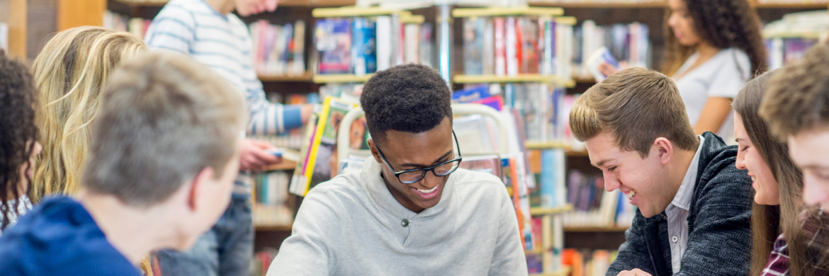 teens working together in library