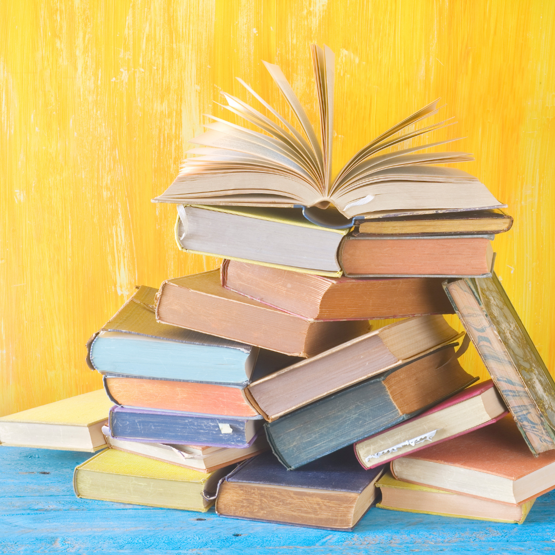 Photo of a colorful pile of books.