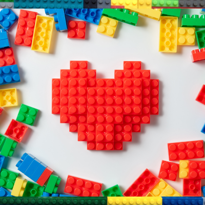 Lego bricks border with a Lego heart in the middle