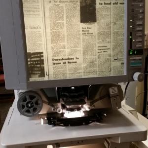 Microfilm reader with 1972 front page of OVN showing