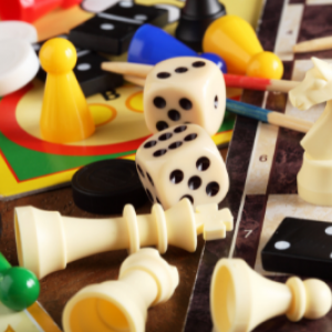 An image of jumbled up board game pieces in varied colors on an unidentifiable gameboard.