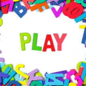 Graphic of the word PLAY spelled out in multicolored letters on a white background with random layers of multicolored letters of the alphabet around image border.