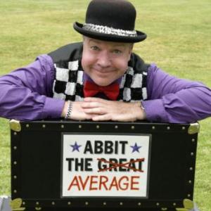 magician on top of sign that says abbit the great, and then great is crossed out and replaced with the word average