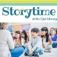 Storytime at the Ojai Library. children sitting happily listening to a story.